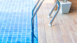 Swimming pool with stair in hotel pool resort